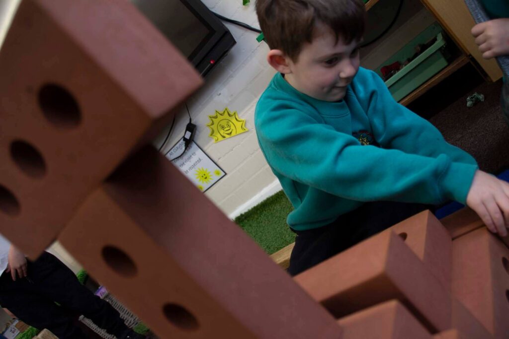 boy building with bricks
